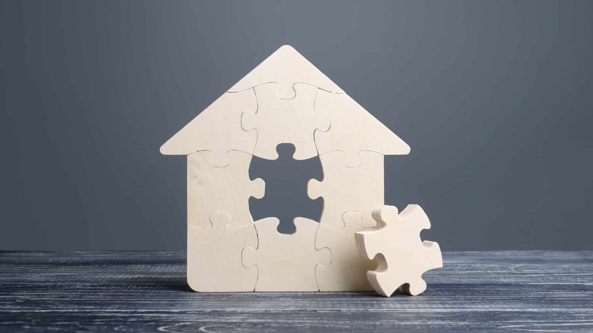 Puzzle house with a missing piece. The acquisition or construction comfortable dream home. Mortgage loan purchase real estate. Arrangement premises repair. Availability and cheapness. Finish building